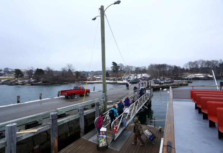 Passengers disembark  from the ferry on Chebeague Island in this Friday, Jan. 29 file photograph. The year-round population of the town hovers around 350, though one resident said this year’s is closer to 400.