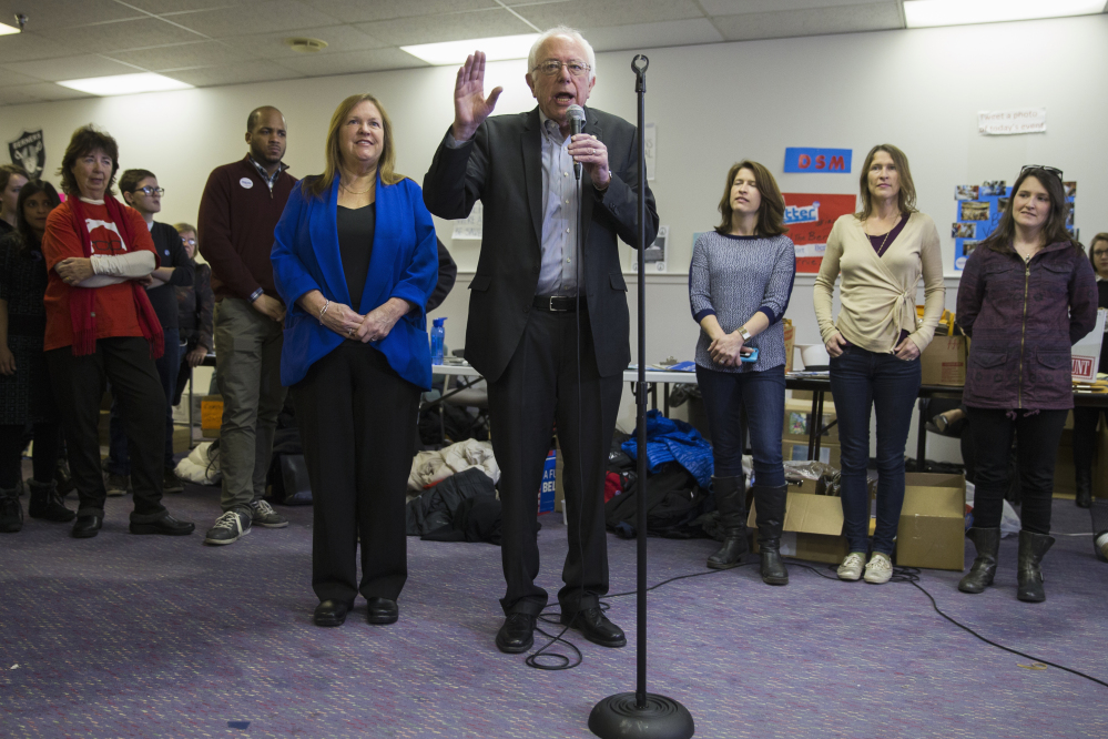 Democratic presidential candidate, Sen. Bernie Sanders, I-Vt., accompanied by his wife Jane, visits his campaign headquarters to thank volunteers, Monday, Feb. 1, 2016, in Des Moines, Iowa.