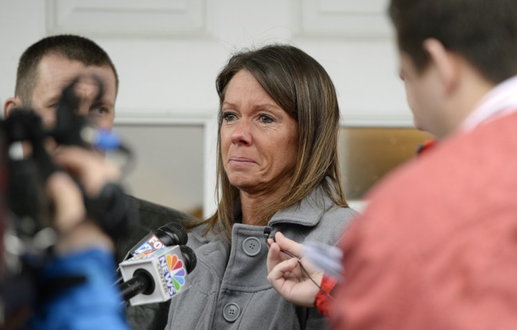 Susan Johnson speaks to the press after James Pak pleaded guilty in York County Superior Court in Alfred on Wednesday. Pak’s plea spared Johnson from having to testify about how she feigned being dead beneath the Christmas tree after she was shot in her apartment on Dec. 29, 2012.