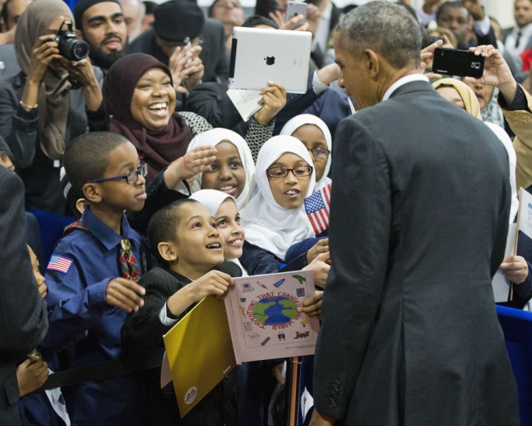President Barack Obama stops to greet children from Al-Rahmah school and other guests during his visit to the Islamic Society of Baltimore on Wednesday in Baltimore, Md.