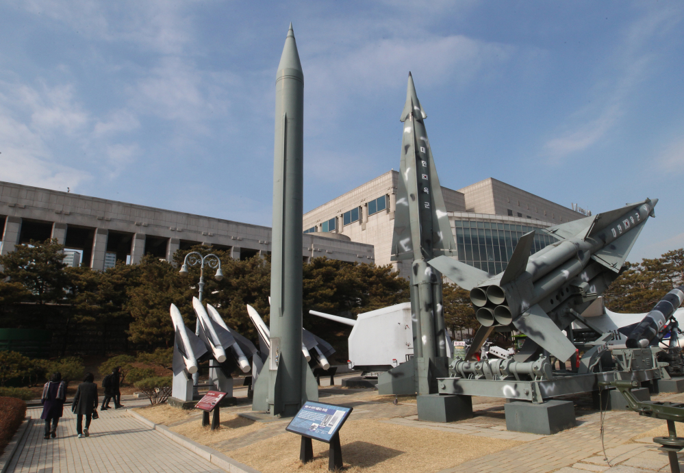 A mock Scud-B missile of North Korea, left, and other South Korean missiles are displayed at the Korea War Memorial Museum in Seoul, South Korea, which on Wednesday warned of “searing” consequences if North Korea doesn’t abandon plans to launch a long-range rocket that critics call a banned test of ballistic missile technology.