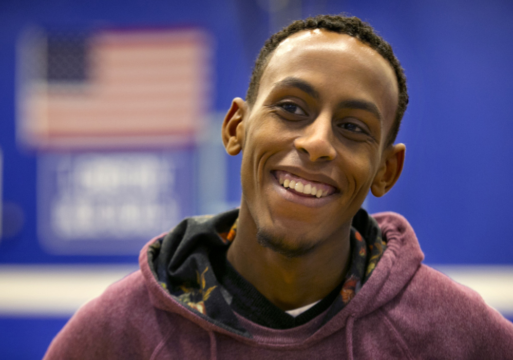 The Associated Press In this Monday, Dec. 14, 2015 photo, Abdi Shariff, co-captain of Lewiston High School’s state championship-winning soccer team, speaks to a reporter in Lewiston, Maine. Shariff spent years in a Kenyan refugee camp before his family relocated to Louisville, Ky., and then Lewiston. “It just shows that people from different races, different cultures, can all work together and accomplish a goal if they want to,” he said. (AP Photo/Robert F. Bukaty)