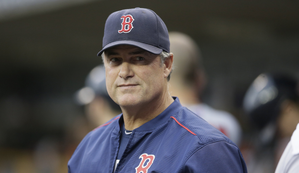 Boston Red Sox manager John Farrell is seen in the dugout during the first inning of a baseball game against the Detroit Tigers, Saturday, Aug. 8, 2015, in Detroit. (AP Photo/Carlos Osorio)