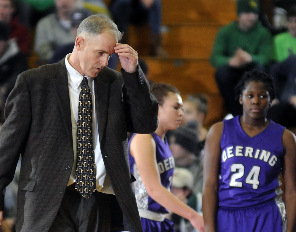 Deering Coach Mike Murphy collects his thoughts during a timeout Tuesday in a Class A North girls’ basketball semifinal against Oxford Hills, which scored the game’s last eight points to secure a 45-35 win.