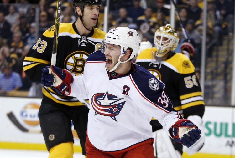 The Blue Jackets’ Boone Jenner celebrates his first-period goal Monday night in Boston. Columbus went on to a 6-4 win as Jenner scored two goals.
