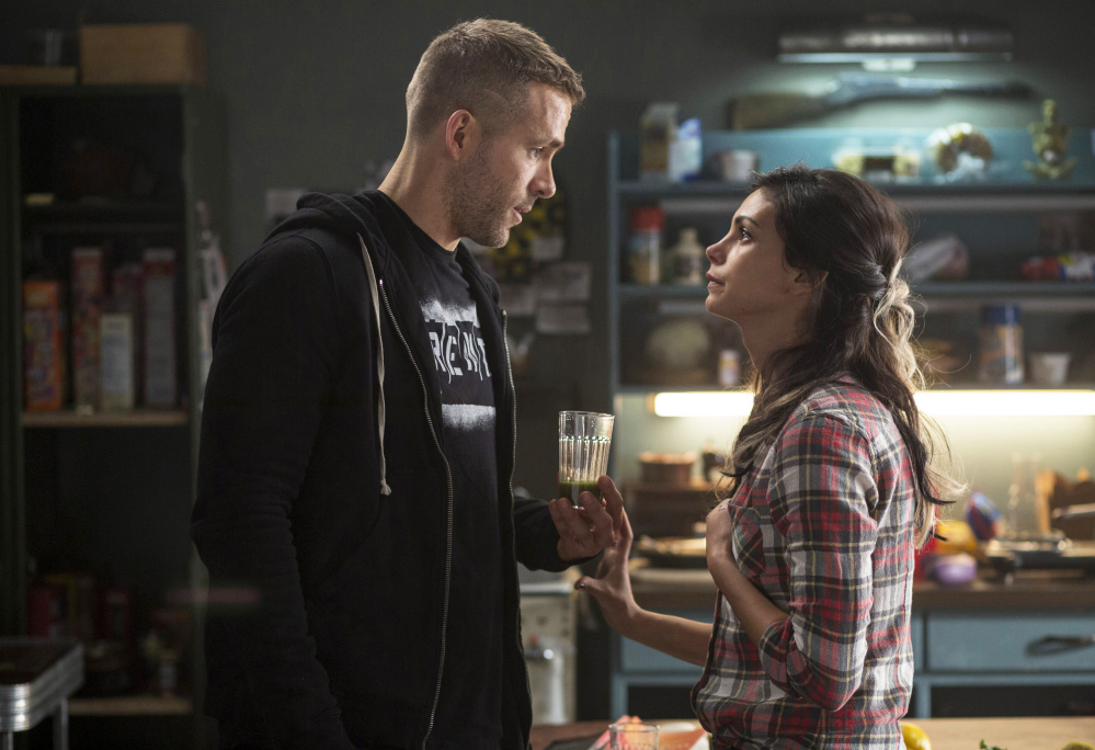 Ryan Reynolds and Morena Baccarin appear in a scene from the film “Deadpool” from Twentieth Century Fox.