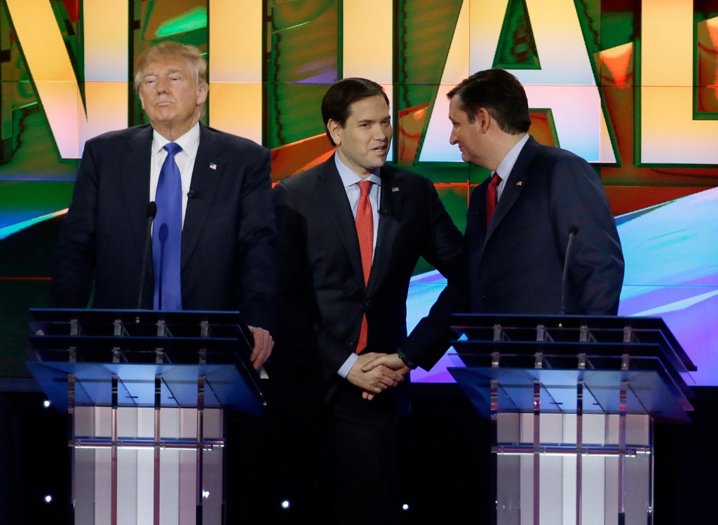 Donald Trump pauses as Marco Rubio and Ted Cruz greet each other during a break in the Republican presidential debate Thursday night at the University of Houston.
The Associated Press