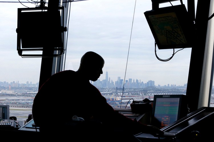 An air traffic controller works in the tower at Newark Liberty International Airport.