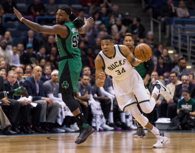 Milwaukee's Giannis Antetokounmpo steals a pass intended for Boston's Jae Crowder during the first half Tuesday.   The Associated Press