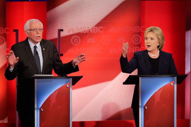 Bernie Sanders and Hillary Clinton spar during Thursday night's debate at the University of New Hampshire. The candidates differed over how to achieve liberal goals and Sanders' effort to cast Clinton as beholden to Wall Street.
The Associated Press