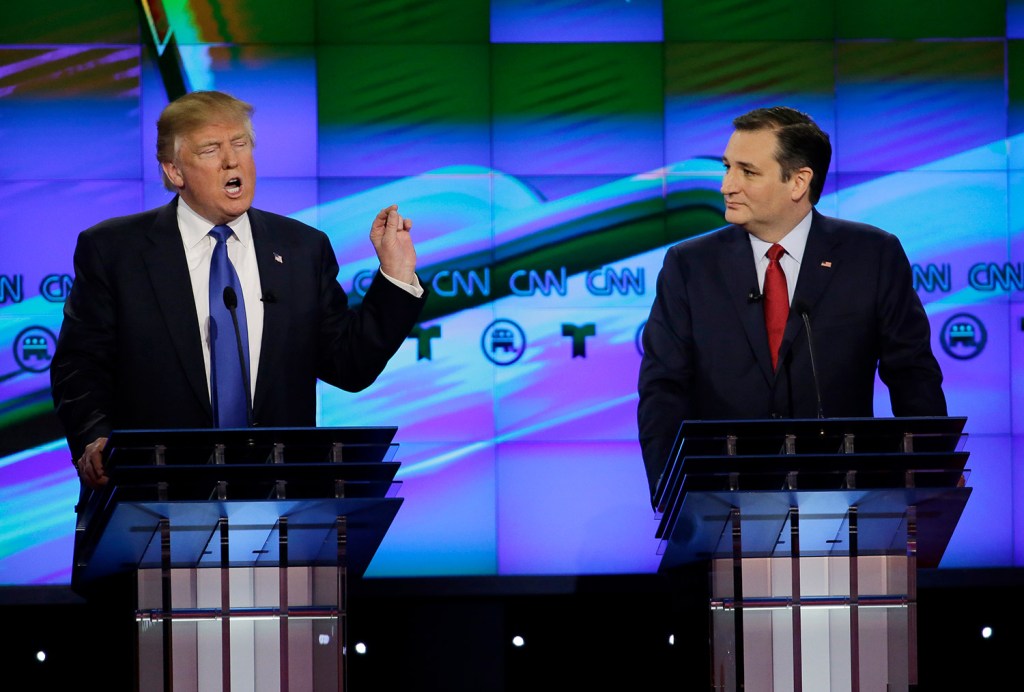Trump speaks as his rival Ted Cruz looks in Thursday's debate. Cruz and Marco Rubio said that Trump had had to pay a $1 million fine for illegal immigration hiring.
The Associated Press