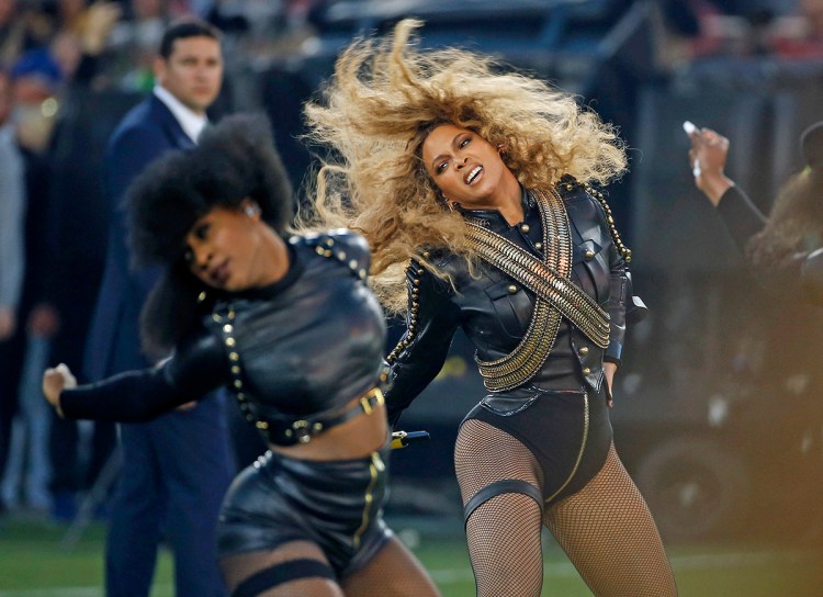 Beyonce performs during halftime of the NFL Super Bowl 50 football game in Santa Clara, Calif. Red Lobster says sales surged 33 percent on Sunday from a year ago. The Associated Press