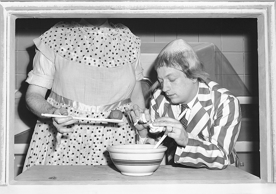 In this Jan. 2, 1952, TV publicity photo, Bob Elliott as Uncle Eugene is instructed in the fine art of making meat ball stuffing by Ray Goulding (face not shown) as Mary McGoon. The Associated Press