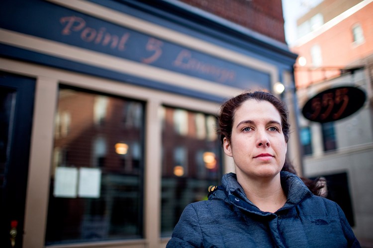 Heather McIntosh of Portland, in front of her soon-to-be former employer, Five Fifty-Five on Congress Street, said in a letter to the editor that she and her co-workers disagree with the restaurant's owners and favor an increase in the minimum wage, including for servers. 
Gabe Souza/Staff Photographer
