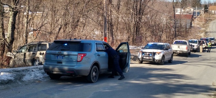 A Maine State Police cruiser is just one in a long line of law enforcement vehicles at the scene of an accident, where a Wilton man who escaped from a Franklin County Jail transport crashed an SUV he allegedly stole from a Wilton homeowner Tuesday morning.