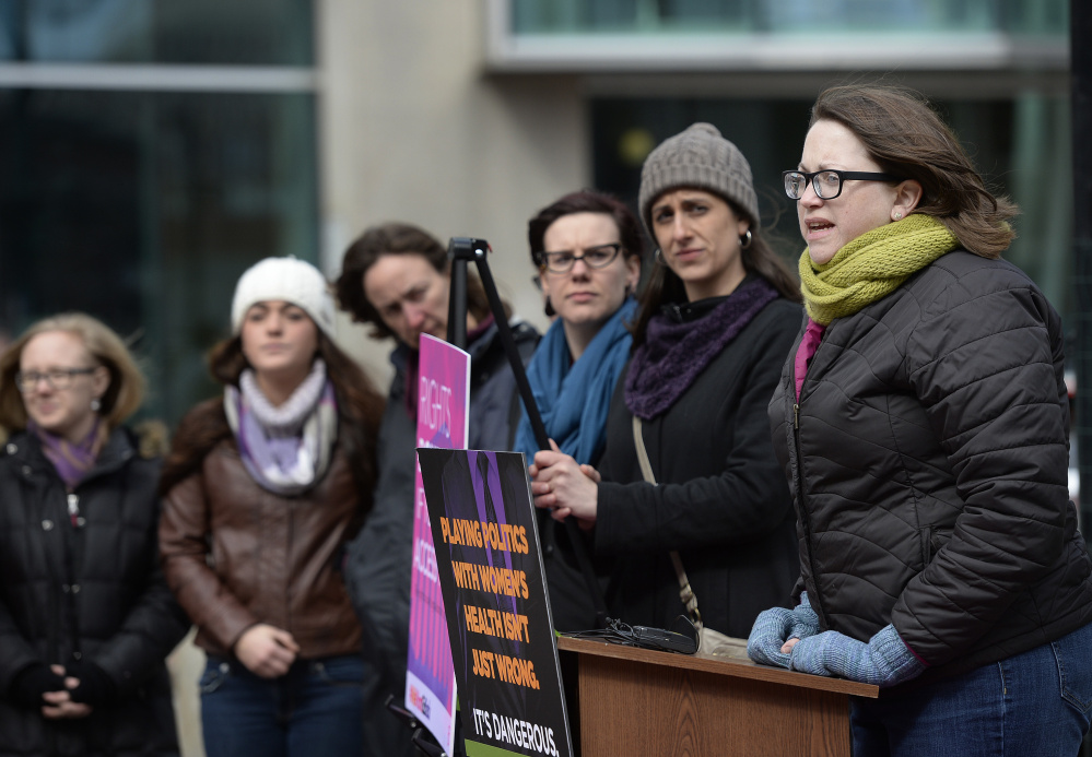 Kate Brogan, far right, of Maine Family Planning in Augusta, speaks during a rally at Monument Square in Portland on Wednesday in support of women in Texas following arguments before the U.S. Supreme Court on a Texas law that limits the number of abortion clinics.