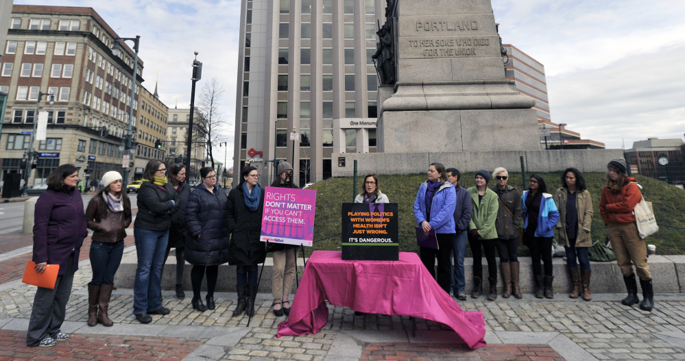 Planned Parenthood, the ACLU of Maine and other groups rally at Monument Square in Portland  arguments before the U.S. Supreme Court on a Texas law that limits the number of abortion clinics on Wednesday.