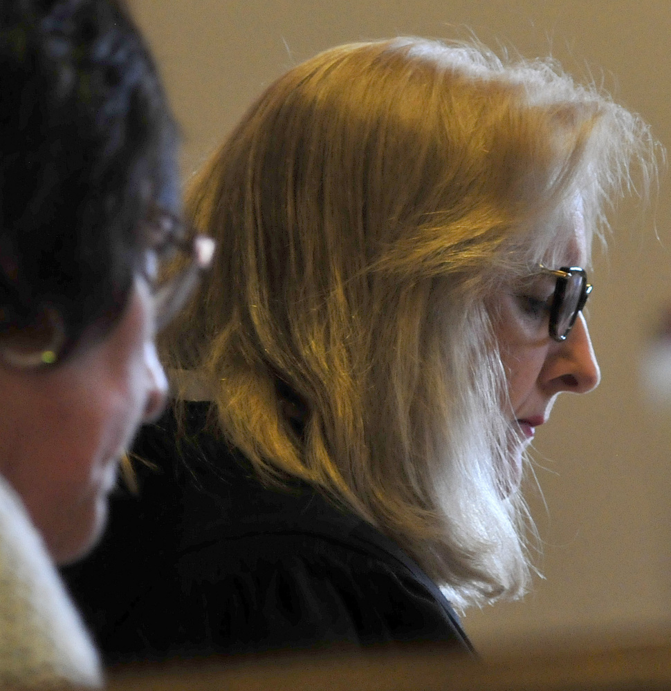 Judge Nancy Carlson reads bail conditions to defendant Derek Cook during a hearing at Rumford District Court on Wednesday.