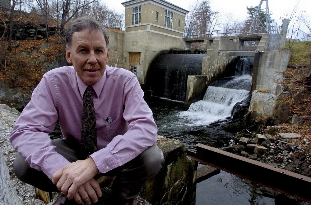 A telephone scammer is calling area businesses, telling them they have to pay a Kennebec Water District bill or their water will be shut off, said General Manager Jeff LaCasse, shown below the Messalonskee Stream hydro dam next to district headquarters on Cool Street in Waterville.
