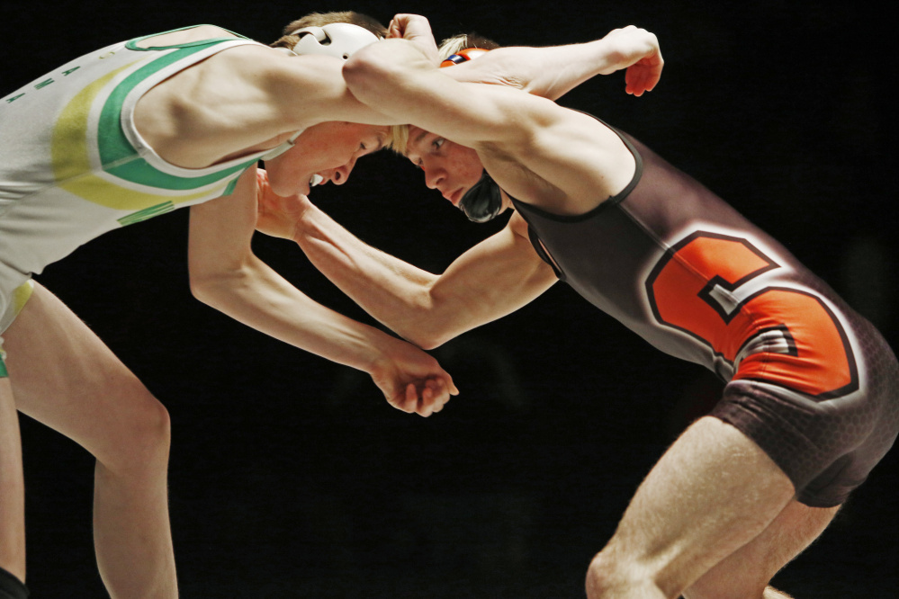 Skowhegan’s Cody Craig, right, wrestles Leo Amabile of Massabesic in the 106-pound finas match at the Class A state championships. Craig won and will be the two seed at the New England championships this weekend.