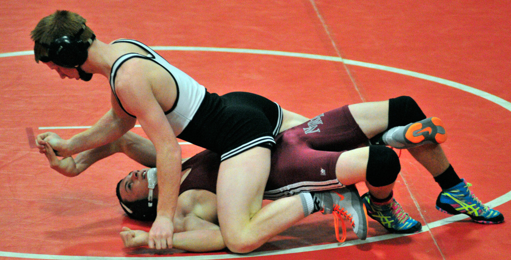 Gardiner’s Pete DelGallo, left, grapples with Nokomis’ Jacob Booth in the 120-pound championship match during the Kennebec Valley Athletic Conference championships at Cony High School.