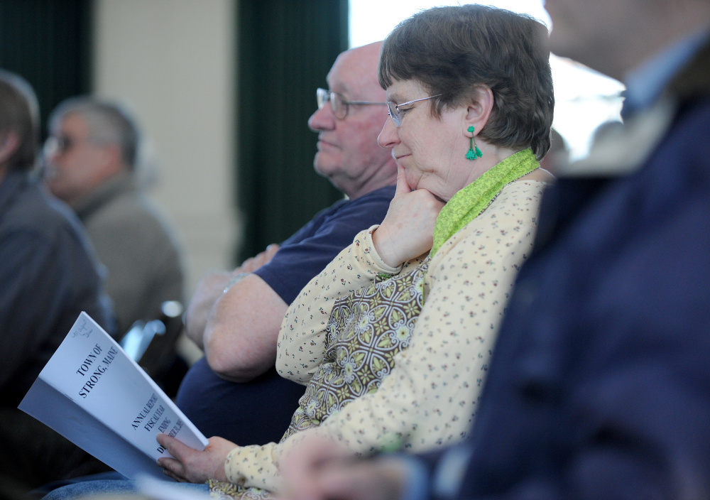 Margaret Huff listens to the day’s agenda Saturday during Town Meeting at the Strong Town Hall.