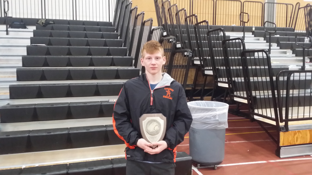 Gardiner senior Peter Del Gallo poses with his championship plaque after he won the 120-pound class title at the New England championships Saturday in Providence, Rhode Island.