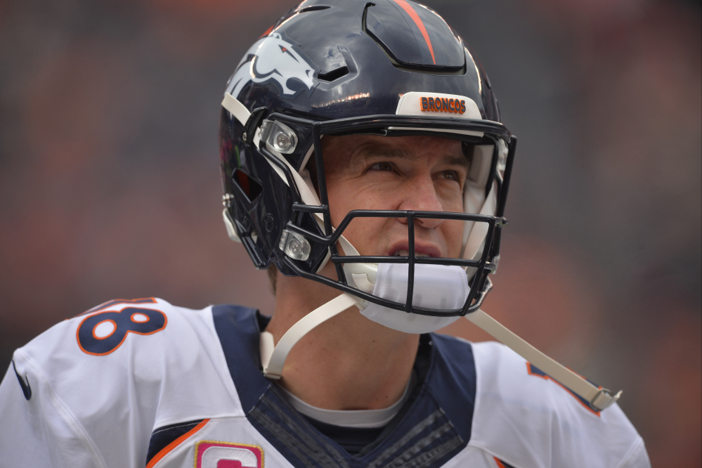 In this Oct. 18, 2015, file photo, Denver Broncos quarterback Peyton Manning stands on the sideline before an NFL football game against the Cleveland Browns in Cleveland. Manning is inching toward a historic repeat.