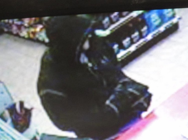 A surveillance camera image of a suspect in a robbery at the Quick Mart in Augusta.