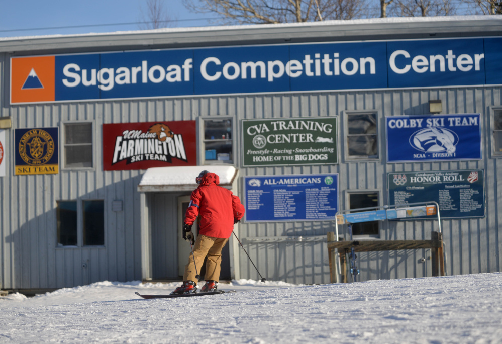 A skier passes the Sugarloaf Competition Center at Sugarloaf Mountain in Carrabassett Valley in January. Carrabasset Valley voters will consider whether to contribute $100,000 to a planned new 11,000-square-foot, $2 million center at Wednesday’s Town Meeting.