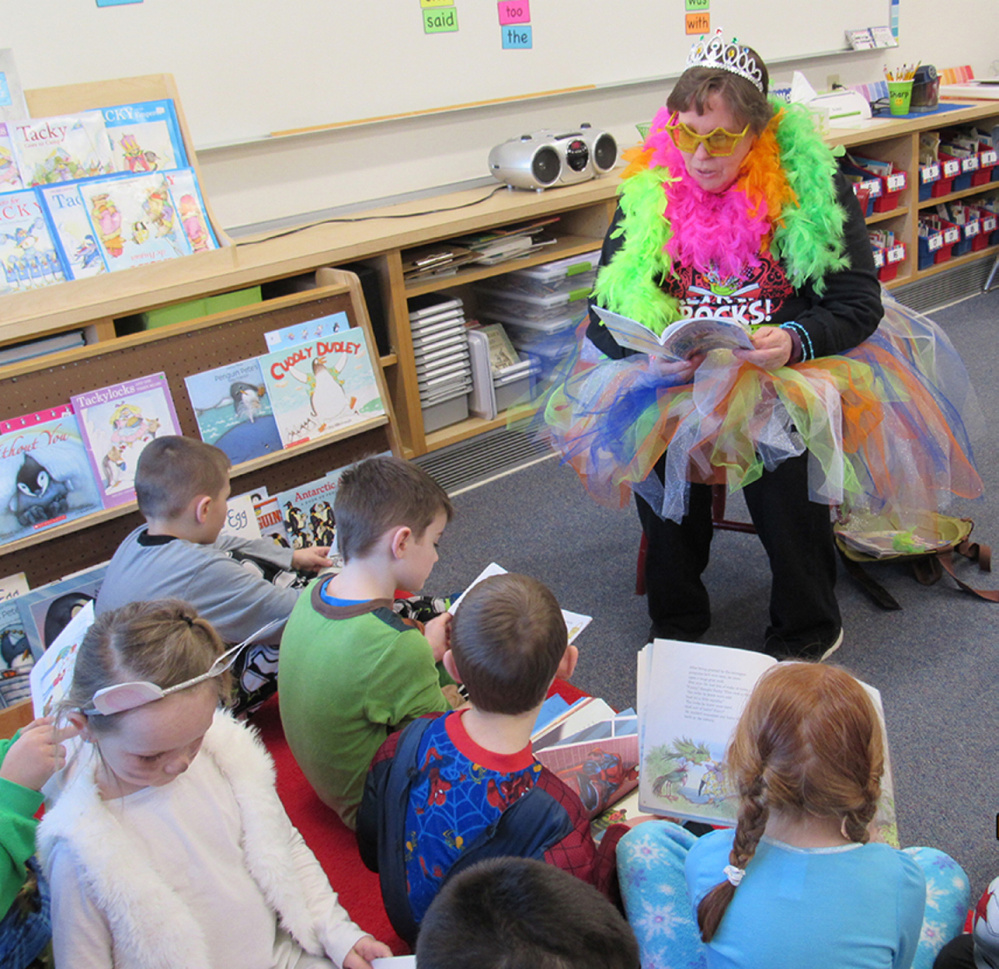 Carol Birch reads to her students.
