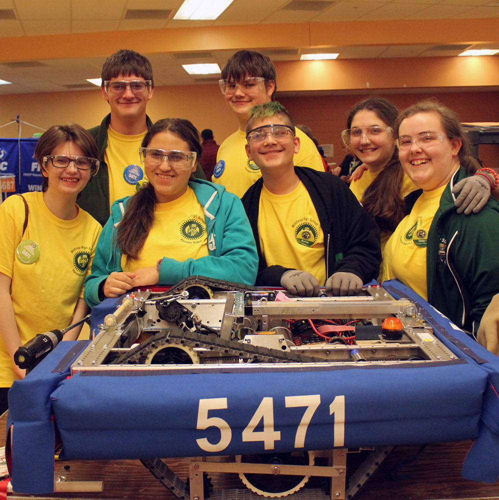 Team members in back, from left, are Joey Tierney, Phillip Easterbrooks and Portia Hardy. In front, from left, are Emma Dwelle, Fantasia Perez, Ryley Lassor and Jess Tozer pose with
the robot, Sir Sherman “the seige engine” Tanksalot, Esq. II.