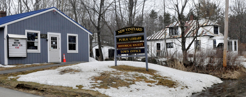 New Vineyard residents will be asked at Town Meeting to spend $15,000 to demolish the town-owned building, right, beside the Town Office on Lake Street in New Vineyard.