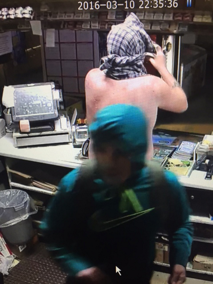This surveillance image from the Flying Pond Variety store in Mount Vernon shows the two people who broke in there Thursday night, according to Maine State Police. Two arrests were made Saturday night, and police are still looking for other suspects.