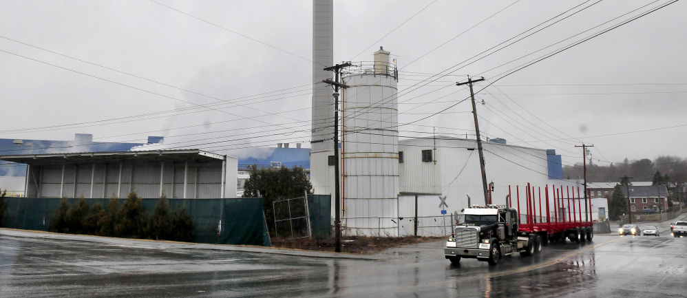 An empty pulp truck passes the Madison Paper Industries mill in Madison on Tuesday, a day after the company announced it will close in May.