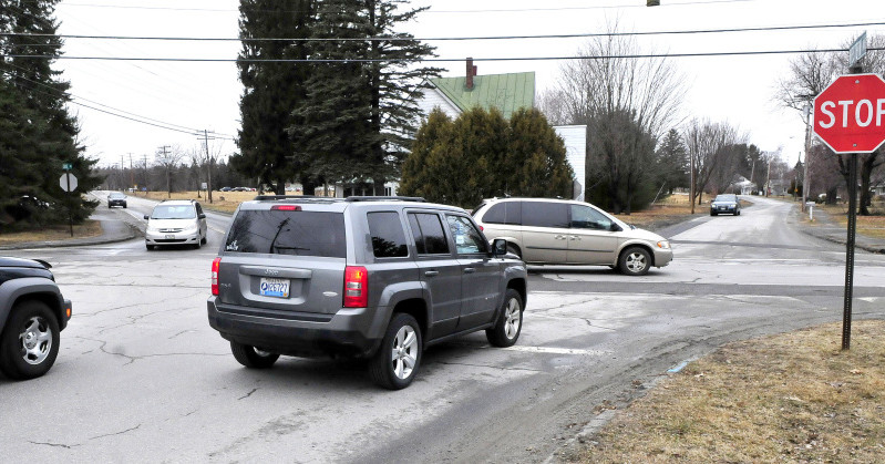 Traffic converges at the busy intersections of First Rangeway and Western and Chase avenues in Waterville on Wednesday. The City Council has awarded a contract to reconfigure the five-way intersection into a four-way intersection.