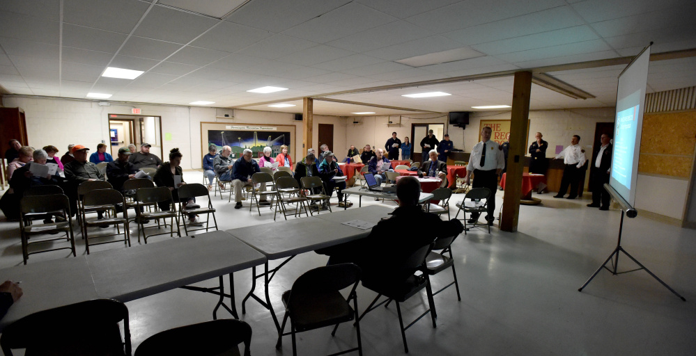 Farmington residents gathered at the Community Center in Farmington on Wednesday to listing to a proposal from Fire Chief Terry Bell to add four full-time firefighters to the volunteer force.
