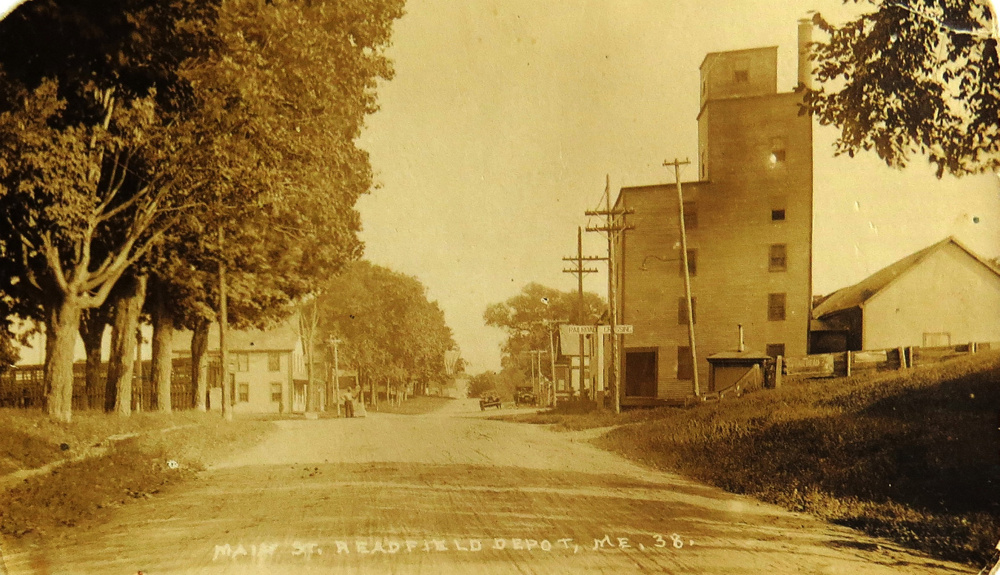 From 1849 until well into the 20th century several homes and businesses appeared at Readfield Depot. There was a school, the Smith Memorial Methodist Church, hotels, liveries and the train station on Main Street. Dominating this 1920s photo is Nelson Gordon’s grain mill, elevator, sawmill and store. On the left can be seen part of the old William Luce Store that was later converted to a tenement house by Gordon.