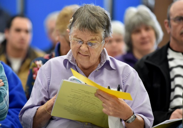Louise Townsend reads the meeting agenda Saturday at Town Meeting at Canaan Elementary School in Canaan.