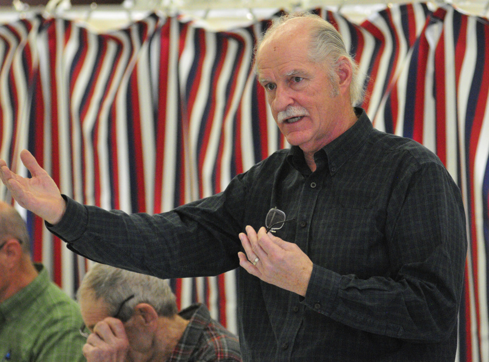 Selectman Greg Couture answers a question during debate at the annual West Gardiner Town Meeting on Saturday in the West Gardiner fire station.
