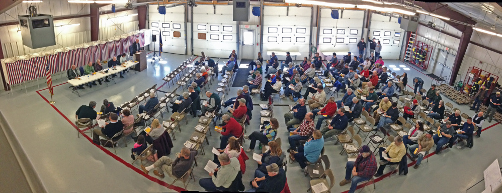 Residents listen to an article during the annual West Gardiner Town Meeting on Saturday in the West Gardiner fire station.