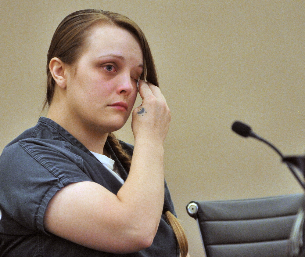 Alyssa Marcellino wipes her eyes during a sentencing for a number of charges including operating after suspension, causing a fatal accident in Monmouth, and other charges on Sept. 2, 2015 the Capital Judicial Center in Augusta. Marcellino is being sued by the widow of Joan Fortier, who was killed in the Monmouth crash.