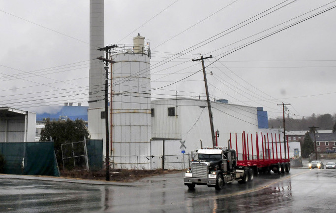 An empty pulp truck passes the Madison Paper Industries mill in Madison last week. The mill is closing in May and town officials said Wednesday they are optimistic about the possibility of getting help from the state.