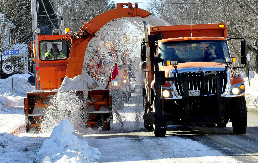 Waterville Public Works crews remove snow in January from Silver Street. It was a rare sight that winter, as mild temperature and lack of snow kept public works spending low across central Maine.