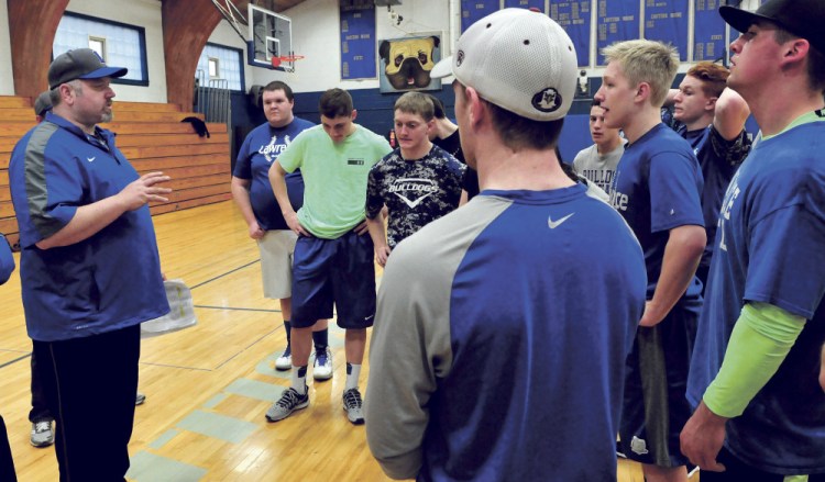 Lawrence baseball coach Rusty Mercier speaks with his team at the end of the first day of practice Monday in Fairfield.