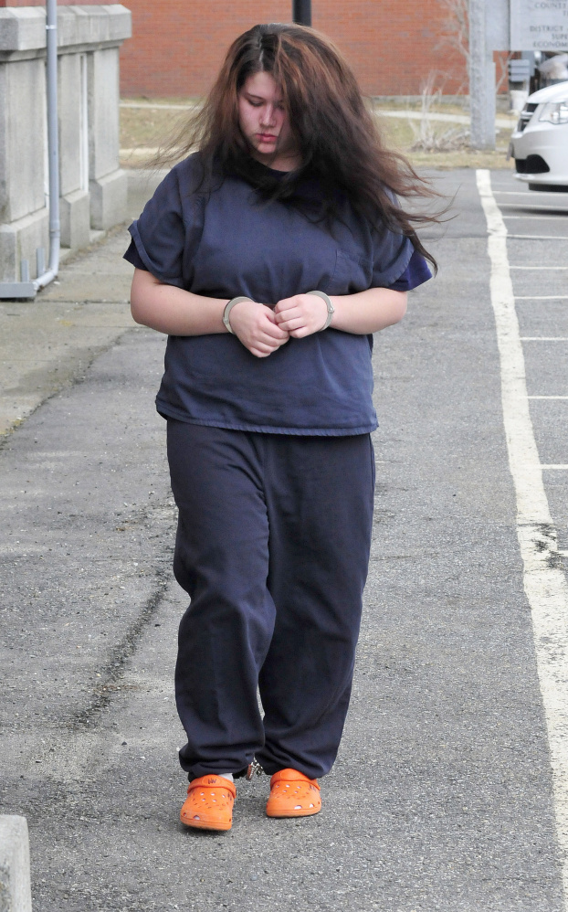 Kayla Stewart of Fairfield is led into Somerset County Superior Court in Skowhegan Tuesday for an arraignment hearing in connection with the death of her newborn child. Stewart pleaded not guilty to charges of murder and manslaughter.