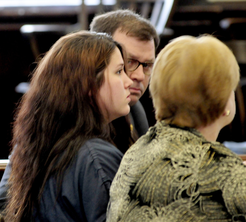 Defendant Kayla Stewart, center, listens to attorneys John Martin and Pamela Ames during arraignment in Somerset County Superior Court in Skowhegan on Tuesday.