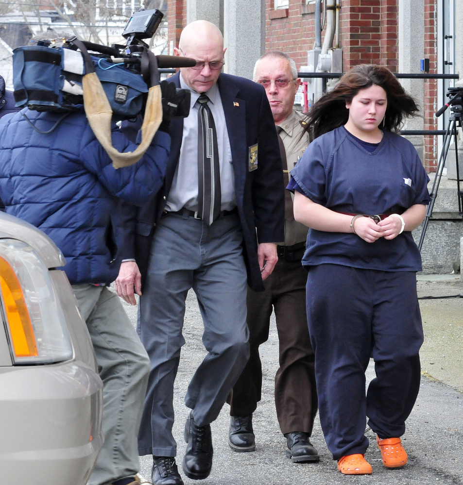 Defendant Kayla Stewart of Fairfield is led from Somerset County Superior Court in Skowhegan on Tuesday by deputies following an arraignment hearing in the death of her newborn. Stewart pleaded not guilty to charges of murder and manslaughter.
