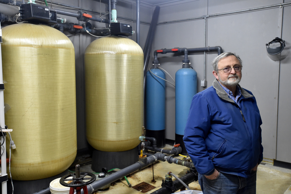 Forrest Bonney, the operator and chairman of the board of the New Sharon Water District, stands inside the town's water treatment plant Tuesday. The district is struggling to maintain day-to-day operations and hasn't upgraded the plant or infrastructure, but some of its customers are balking at a rate hike that would help fund repairs.