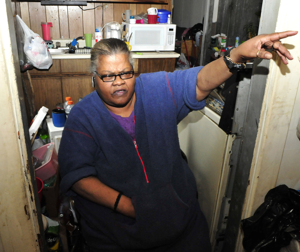 Janette Jones, a tenant at 58 Silver St. in Waterville, speaks on Monday about the arson fire late Sunday that damaged part of a lobby outside her apartment.